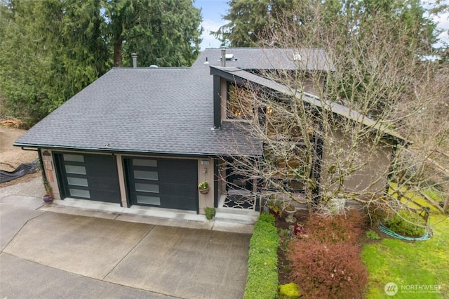 view of front of property with roof with shingles