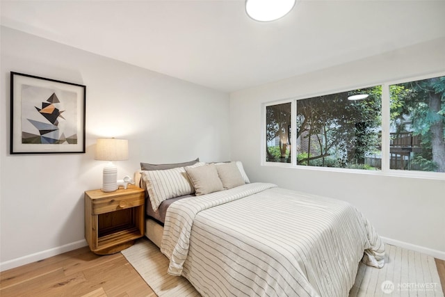3115 103rd Ave NE, Bellevue, WA 98004 - bedroom featuring baseboards and light wood-style flooring