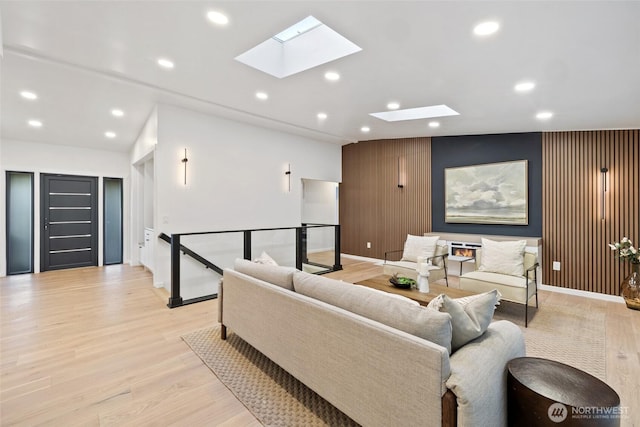 3115 103rd Ave NE, Bellevue, WA 98004 - living area with a skylight, light wood finished floors, baseboards, recessed lighting, and an accent wall