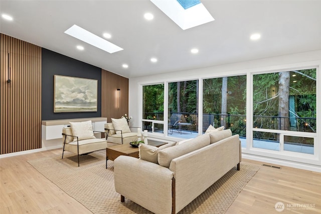 3115 103rd Ave NE, Bellevue, WA 98004 - living room with a skylight, vaulted ceiling, wood finished floors, and recessed lighting