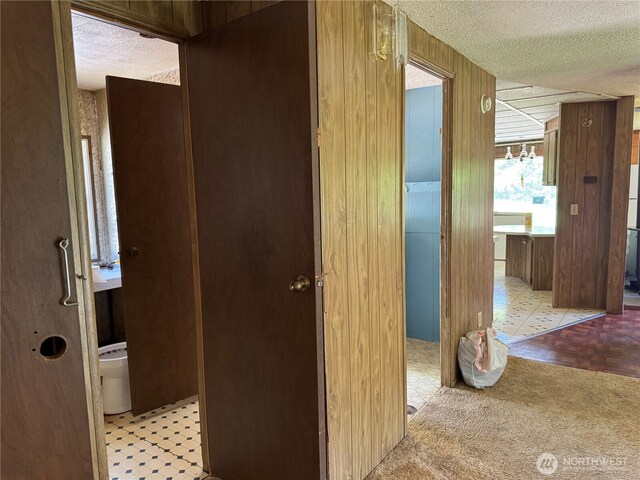 hallway featuring a textured ceiling
