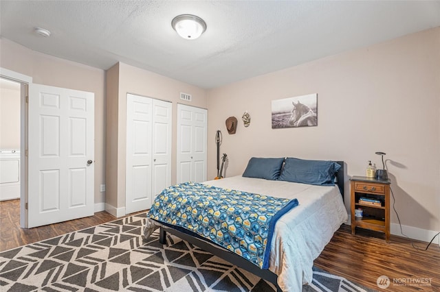 207 Harmon St, Waitsburg, WA 99361 - bedroom featuring washer / clothes dryer, baseboards, a closet, and wood finished floors