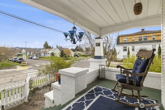 902 Wood Ave, Sumner, WA 98390 - view of patio / terrace with a residential view, a porch, and fence