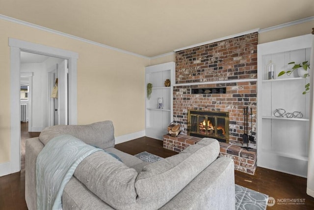 902 Wood Ave, Sumner, WA 98390 - living area with crown molding, baseboards, wood finished floors, and a fireplace