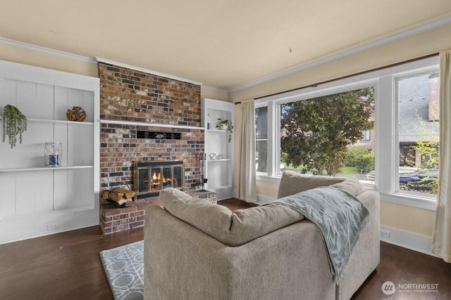 902 Wood Ave, Sumner, WA 98390 - living area featuring wood finished floors, baseboards, ornamental molding, and a brick fireplace