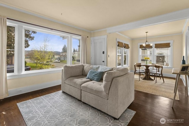902 Wood Ave, Sumner, WA 98390 - living room with dark wood-style flooring, ornamental molding, and baseboards