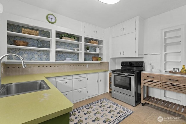 902 Wood Ave, Sumner, WA 98390 - kitchen featuring stainless steel electric range oven, white cabinets, open shelves, a sink, and light countertops