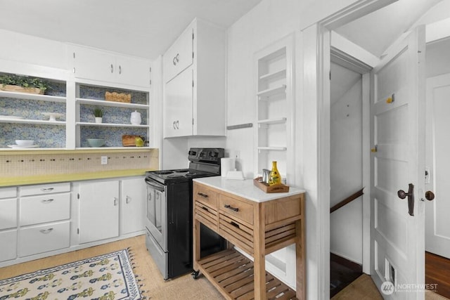 902 Wood Ave, Sumner, WA 98390 - kitchen featuring light countertops, white cabinets, open shelves, and electric range