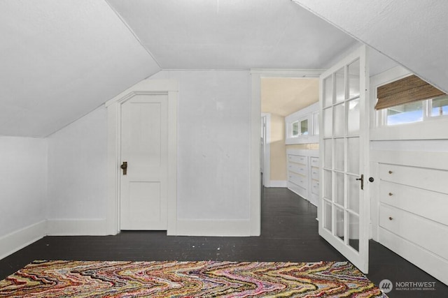 902 Wood Ave, Sumner, WA 98390 - additional living space featuring dark wood-style flooring, baseboards, and lofted ceiling