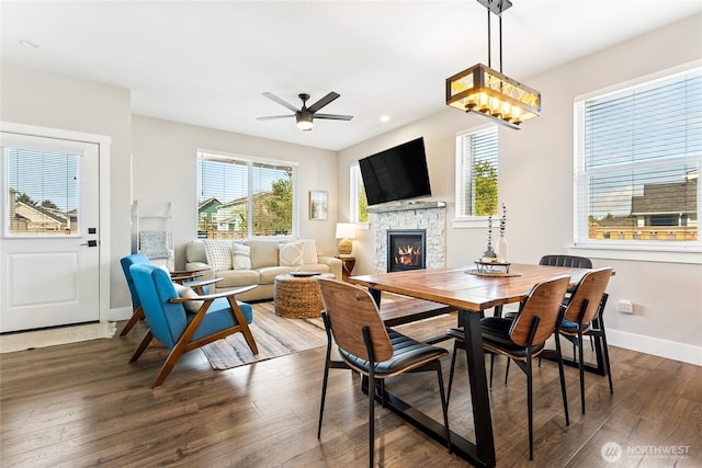 441 Lupine Ln SW, Ocean Shores, WA 98569 - dining area featuring a ceiling fan, a fireplace, baseboards, recessed lighting, and dark wood-style flooring