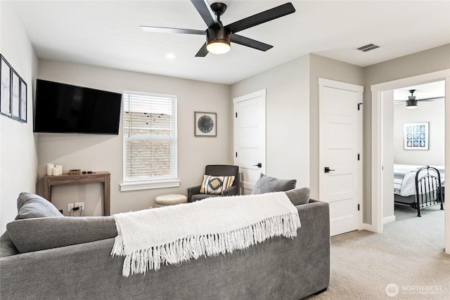 441 Lupine Ln SW, Ocean Shores, WA 98569 - living room featuring baseboards, ceiling fan, visible vents, and light carpet