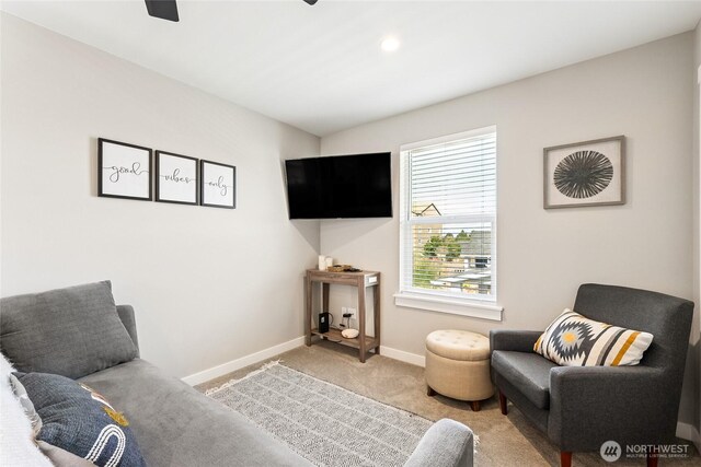 441 Lupine Ln SW, Ocean Shores, WA 98569 - carpeted living room featuring baseboards and ceiling fan