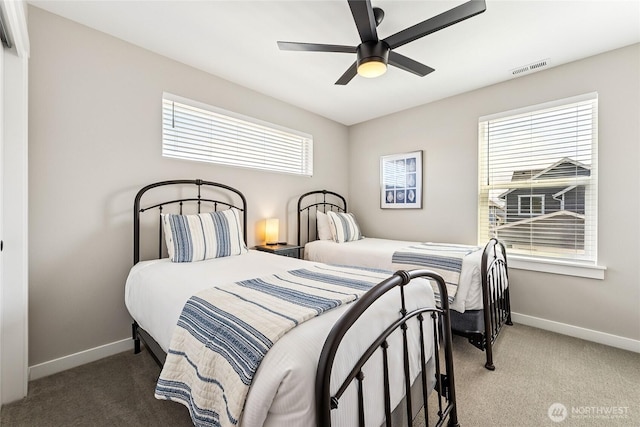 441 Lupine Ln SW, Ocean Shores, WA 98569 - carpeted bedroom featuring baseboards, visible vents, and a ceiling fan