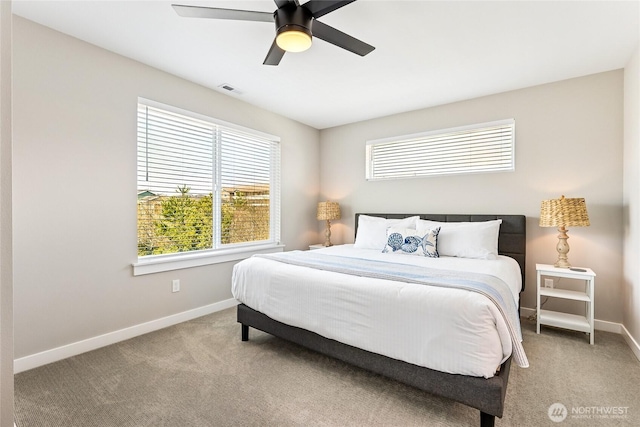 441 Lupine Ln SW, Ocean Shores, WA 98569 - carpeted bedroom featuring baseboards, visible vents, and a ceiling fan
