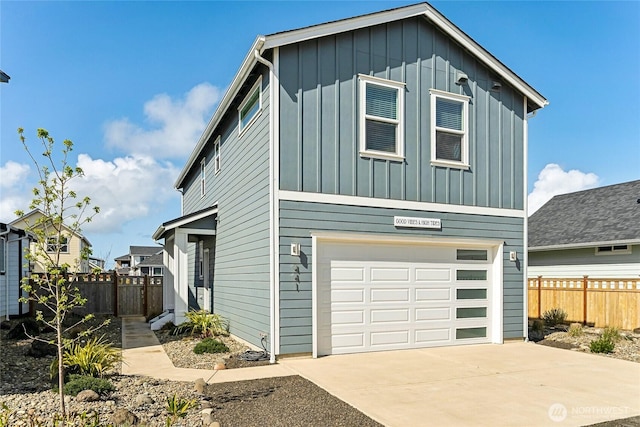 441 Lupine Ln SW, Ocean Shores, WA 98569 - view of front of property featuring driveway, an attached garage, fence, and board and batten siding