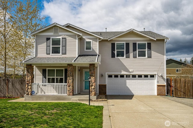 402 Easy St SE, Rainier, WA 98576 - view of front facade featuring stone siding, covered porch, fence, and concrete driveway