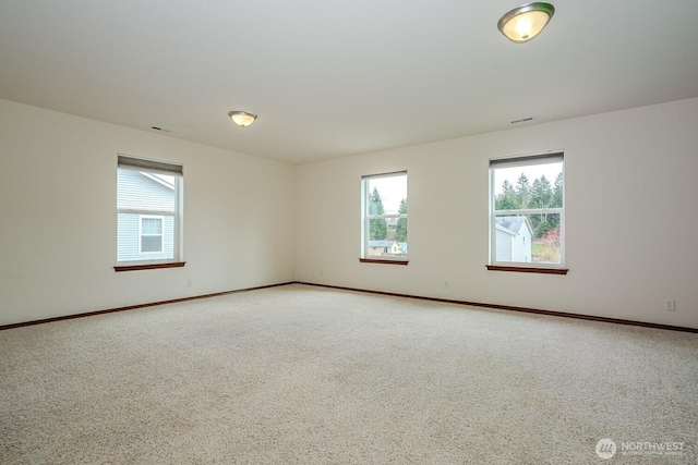 402 Easy St SE, Rainier, WA 98576 - spare room with a healthy amount of sunlight, light colored carpet, and visible vents