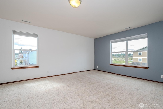 402 Easy St SE, Rainier, WA 98576 - carpeted spare room featuring baseboards and visible vents