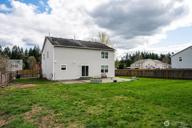 402 Easy St SE, Rainier, WA 98576 - rear view of house with a fenced backyard, a lawn, entry steps, and a patio area