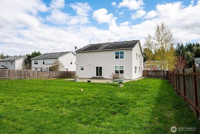402 Easy St SE, Rainier, WA 98576 - back of house with a lawn, a fenced backyard, and a patio area