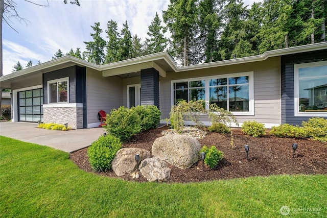 5469 Wood Duck Loop, Blaine, WA 98230 - mid-century home featuring a front yard, an attached garage, and concrete driveway