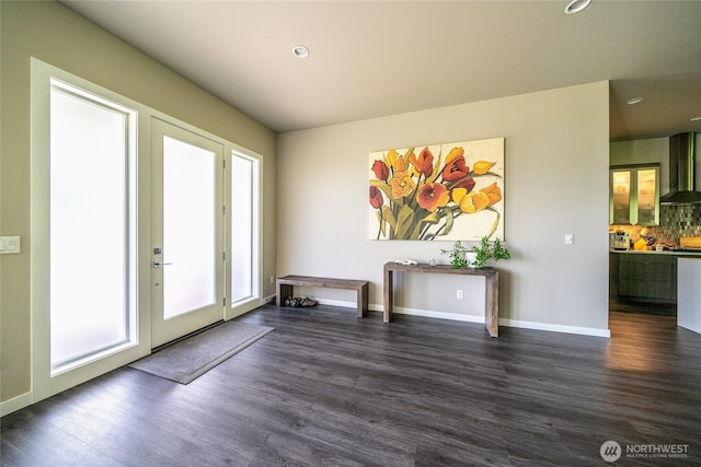 5469 Wood Duck Loop, Blaine, WA 98230 - unfurnished living room with dark wood-style floors, recessed lighting, and baseboards