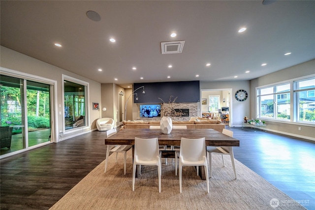 5469 Wood Duck Loop, Blaine, WA 98230 - dining room featuring wood finished floors, a fireplace, baseboards, and recessed lighting