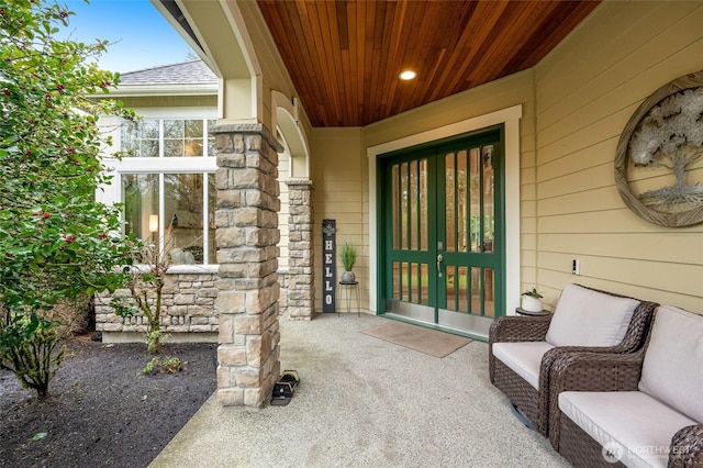 entrance to property with french doors and stone siding