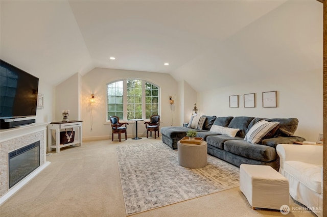 living area featuring baseboards, vaulted ceiling, recessed lighting, a fireplace, and carpet floors