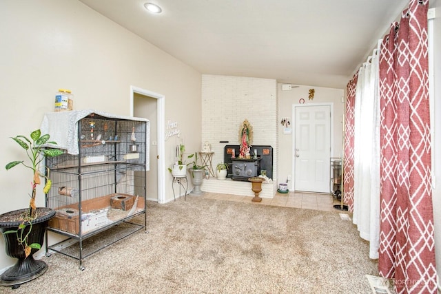 1444 SE Central Ave, College Place, WA 99324 - interior space with carpet floors, vaulted ceiling, and a wood stove