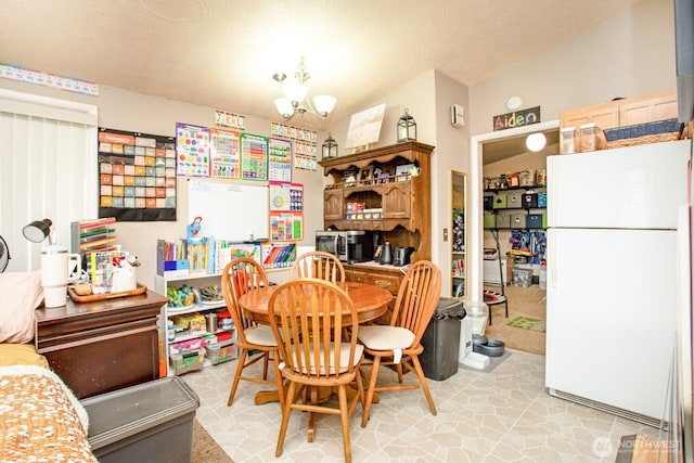 1444 SE Central Ave, College Place, WA 99324 - dining space featuring a textured ceiling and a notable chandelier