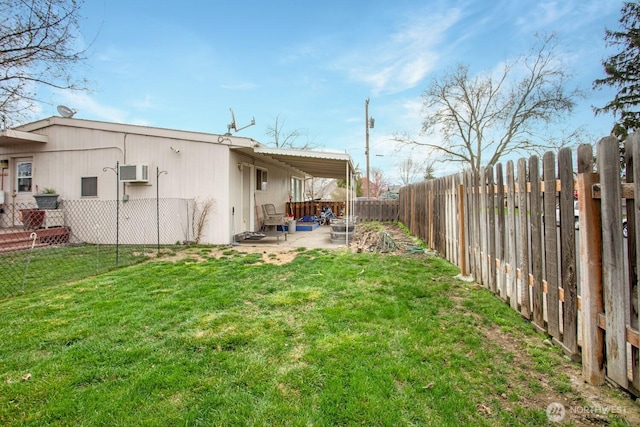 1444 SE Central Ave, College Place, WA 99324 - view of yard featuring a fenced backyard, an AC wall unit, and a patio area