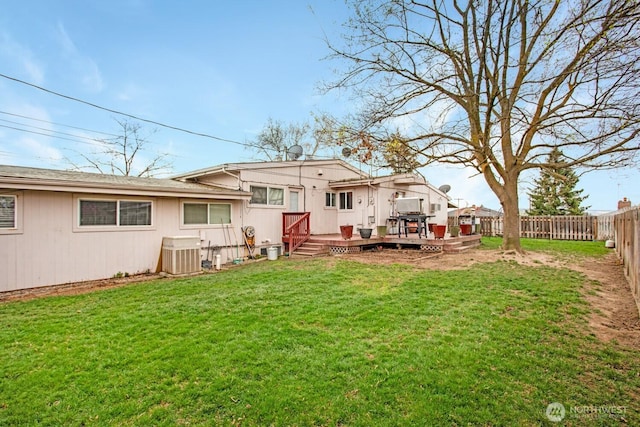 1444 SE Central Ave, College Place, WA 99324 - back of property featuring a fenced backyard, cooling unit, a deck, and a yard