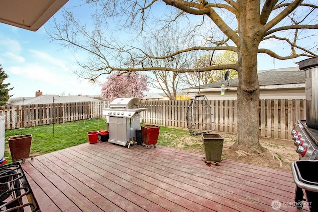 1444 SE Central Ave, College Place, WA 99324 - wooden terrace with a fenced backyard, grilling area, and a yard