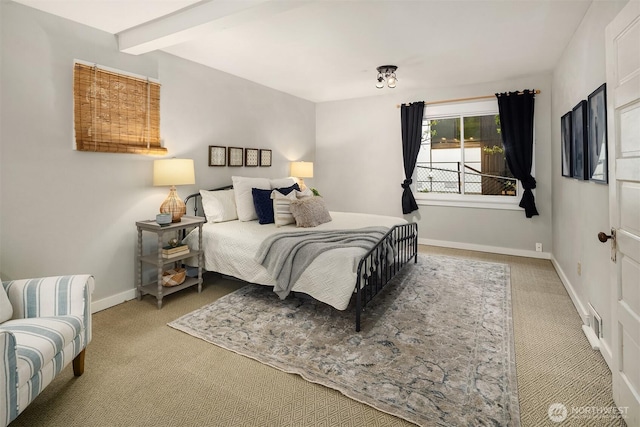 bedroom with carpet flooring and baseboards