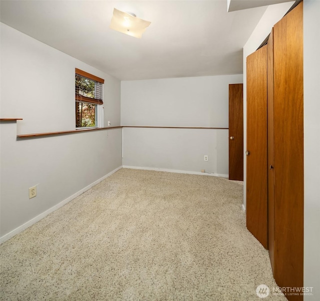 spare room with baseboards