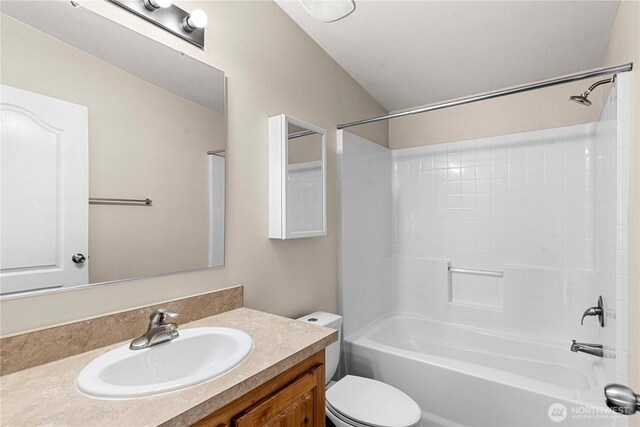bathroom featuring bathing tub / shower combination, toilet, and vanity