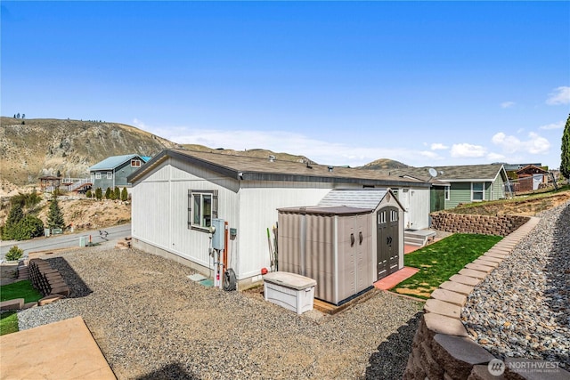 rear view of property with a mountain view