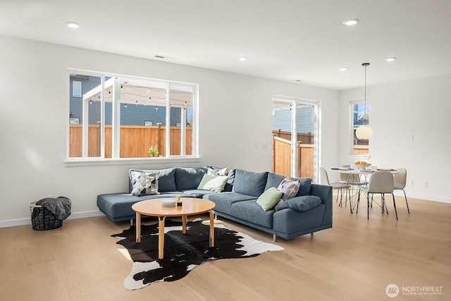 27215 106th Ave SE, Kent, WA 98030 - living room with wood finished floors, baseboards, and recessed lighting