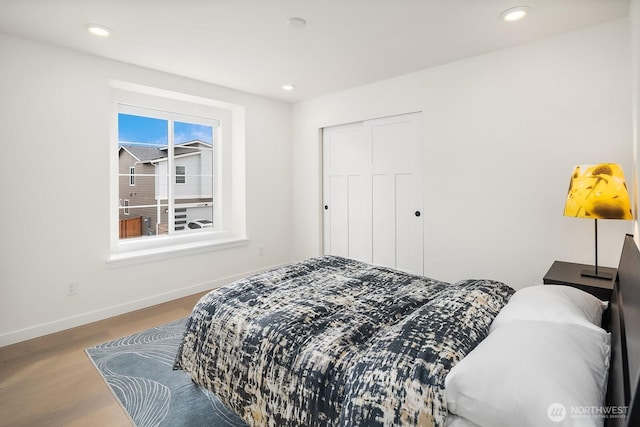 27215 106th Ave SE, Kent, WA 98030 - bedroom featuring a closet, recessed lighting, baseboards, and wood finished floors