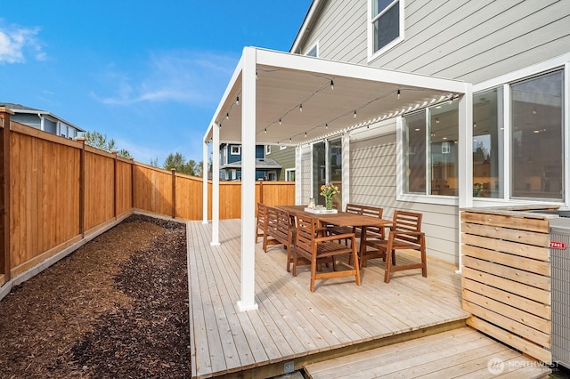 27215 106th Ave SE, Kent, WA 98030 - wooden terrace with outdoor dining space and a fenced backyard