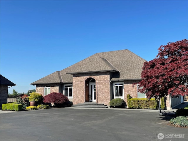 22785 Rallye Ln, Sedro Woolley, WA 98284 - french country home featuring roof with shingles and brick siding