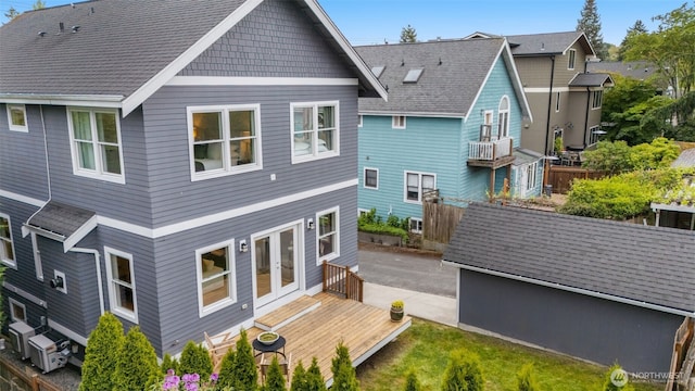 back of property with french doors, fence, and cooling unit