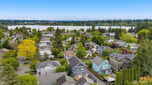 aerial view of residential area featuring a nearby body of water