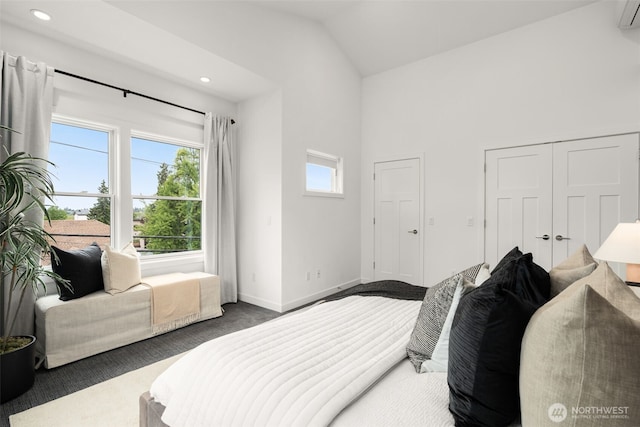 bedroom with carpet, vaulted ceiling, recessed lighting, and baseboards