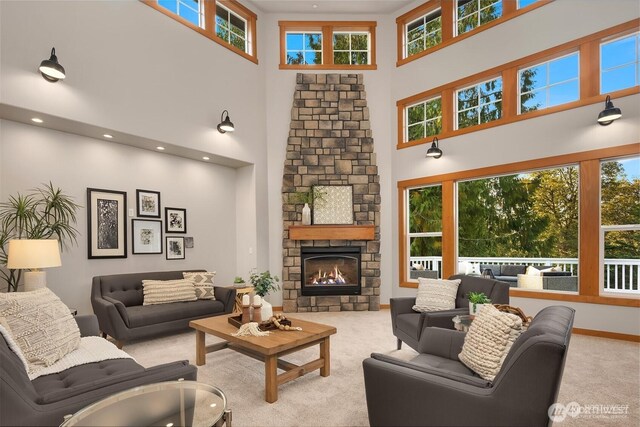 25935 SE 235th Way, Maple Valley, WA 98038 - living area featuring carpet floors, baseboards, a towering ceiling, and a fireplace