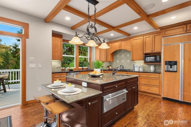 25935 SE 235th Way, Maple Valley, WA 98038 - kitchen featuring coffered ceiling, a warming drawer, built in appliances, and a center island with sink