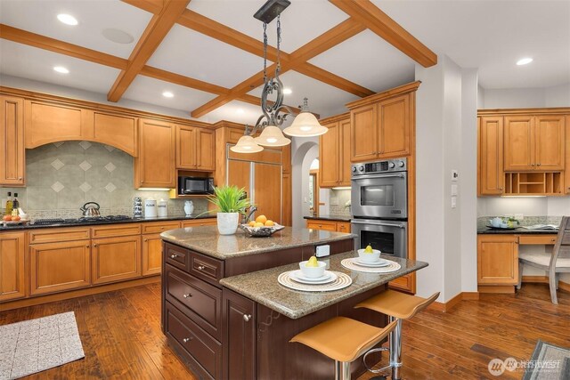 25935 SE 235th Way, Maple Valley, WA 98038 - kitchen with dark wood-style flooring, black microwave, a center island, stainless steel double oven, and a sink