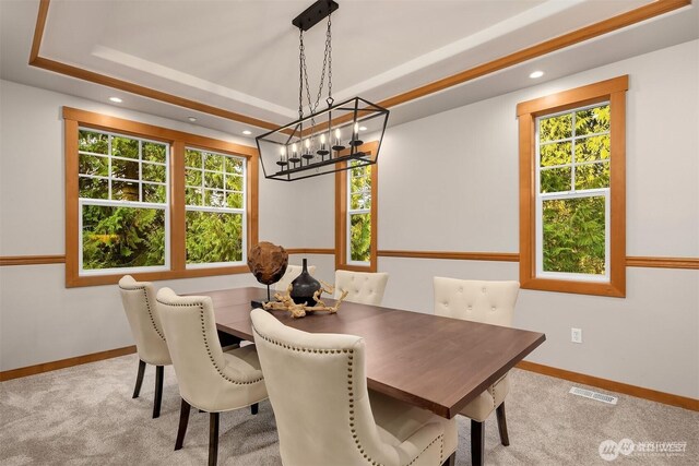 25935 SE 235th Way, Maple Valley, WA 98038 - carpeted dining area with a chandelier, plenty of natural light, visible vents, and a tray ceiling
