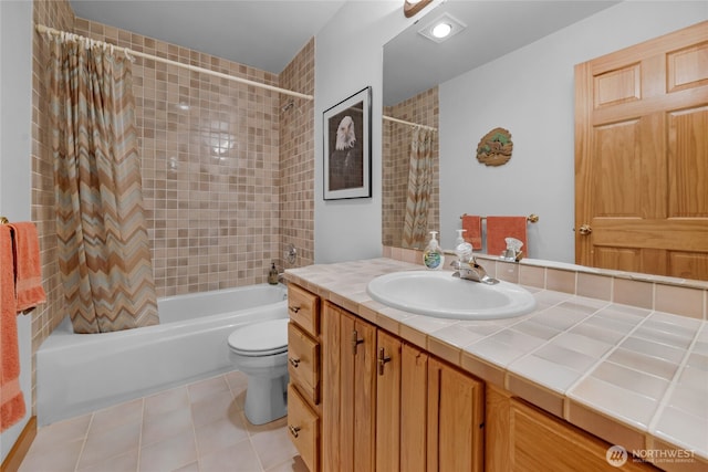 full bath with toilet, shower / tub combo, vanity, and tile patterned flooring